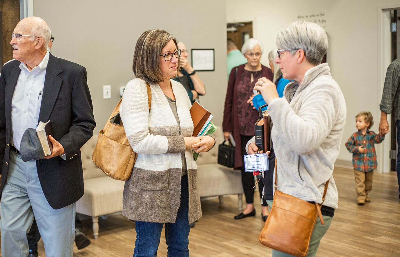 two ladies at church talking with each other